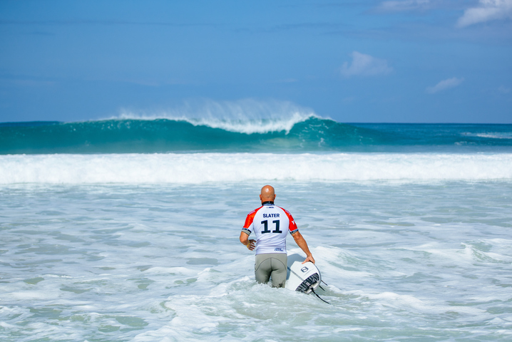 Image: 52 year old Kelly Slater making his way out to pumping Pipeline yesterday. Source: WSL/Tony Heff